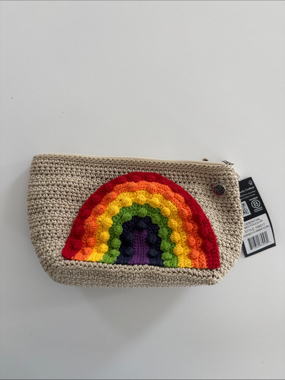 The Sak Beige Crochet Pouch with Rainbow Applique